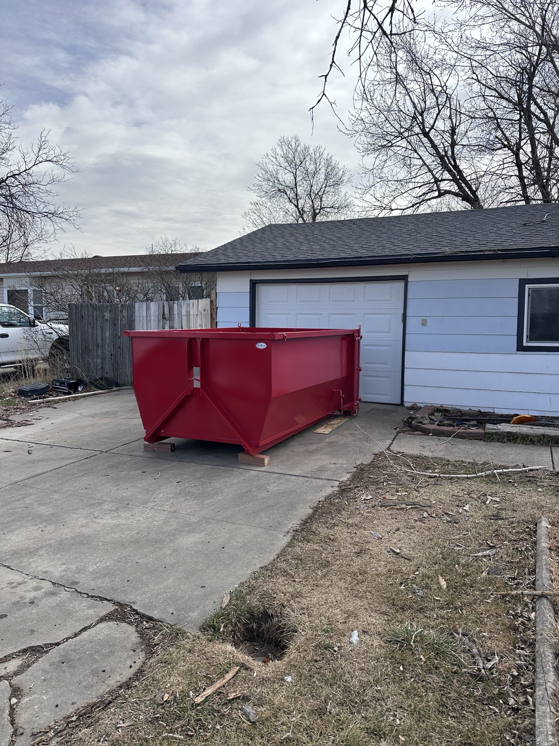 Driveway dumpster rental for garage cleanout